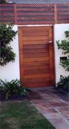 Beautiful cedar door with contrast timber fence top